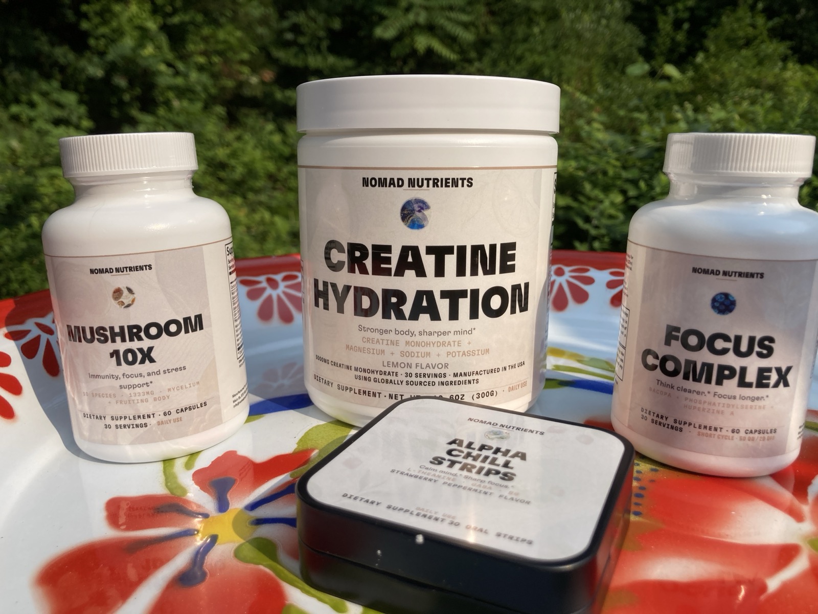 All four Nomad Nutrients products together, shot outdoors in natural light in Hanoi